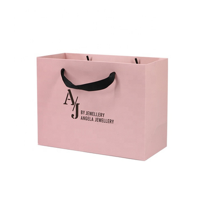 La laminazione lucida calza i sacchi di carta che dell'abbigliamento 250gam ha ricoperto le borse rosa di Kraft