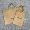 200pcs al nastro dei sacchi di carta dell'abbigliamento di timbratura di oro 500pcs tratta i sacchetti della spesa di Kraft