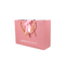 La laminazione lucida calza i sacchi di carta che dell'abbigliamento 250gam ha ricoperto le borse rosa di Kraft